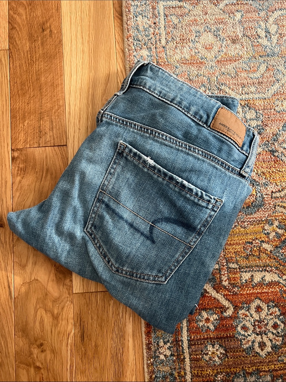 American Eagle Outfitters Light Blue Denim Jeans with Tan Leather Patch